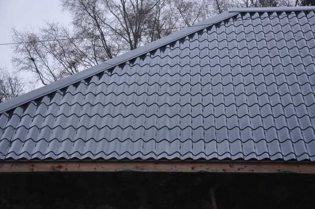 11. OmlaE295A0eggning av falsat bandtaE295A0eckt plaE295A0ettak paE295A0e ladugaE295A0erd
